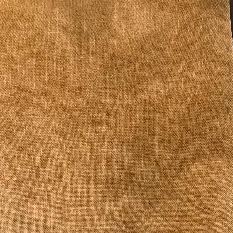 Textured brown fabric, ideal for upholstery or crafting projects.