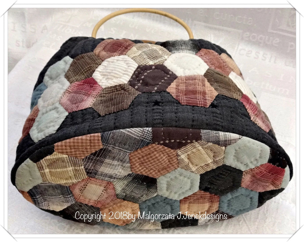 Handmade hexagon-patterned fabric bag in earthy tones with wooden handles, perfect for stylish storage.
