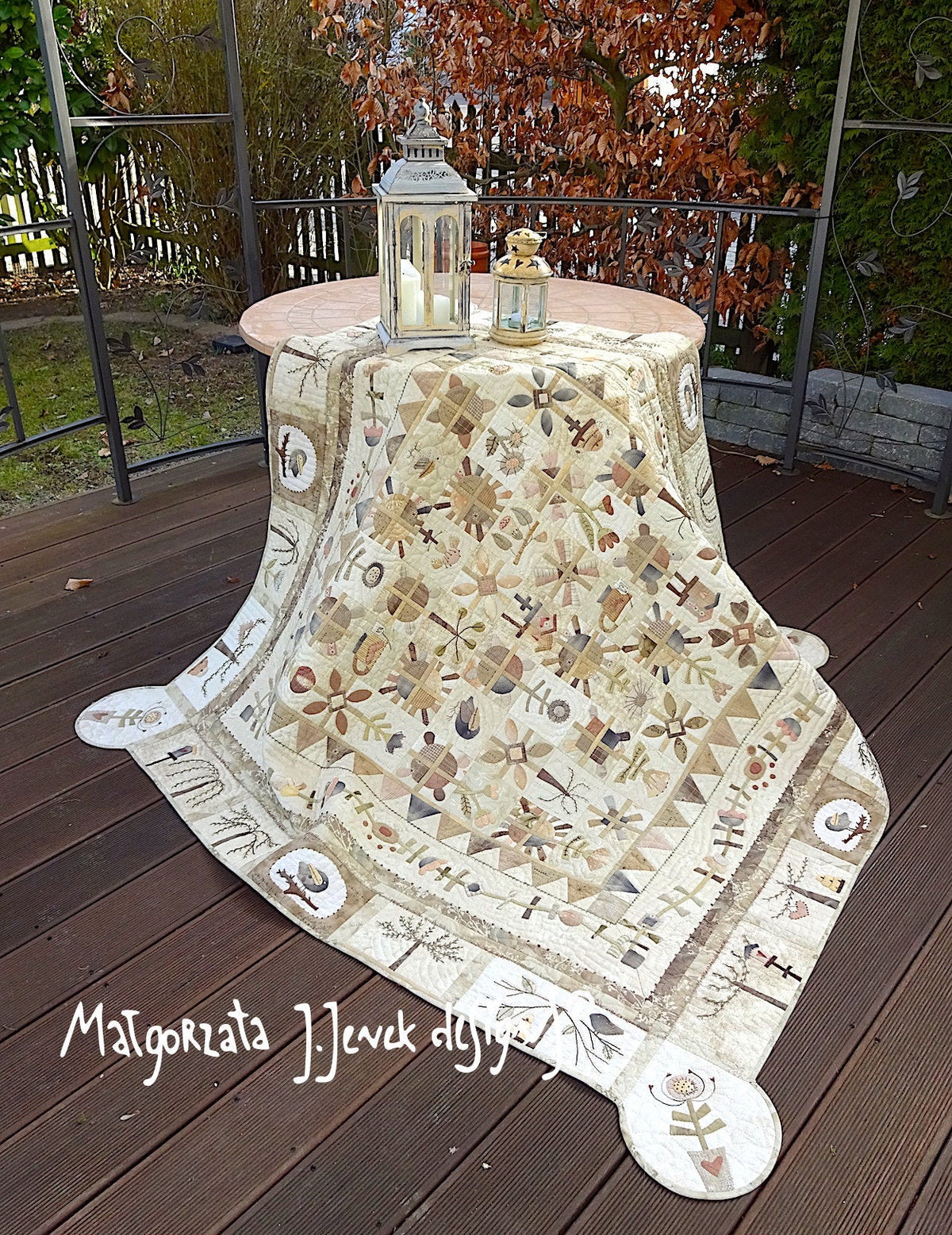 Handmade quilt table cover in beige, featuring floral patterns and intricate designs, perfect for home decor.
