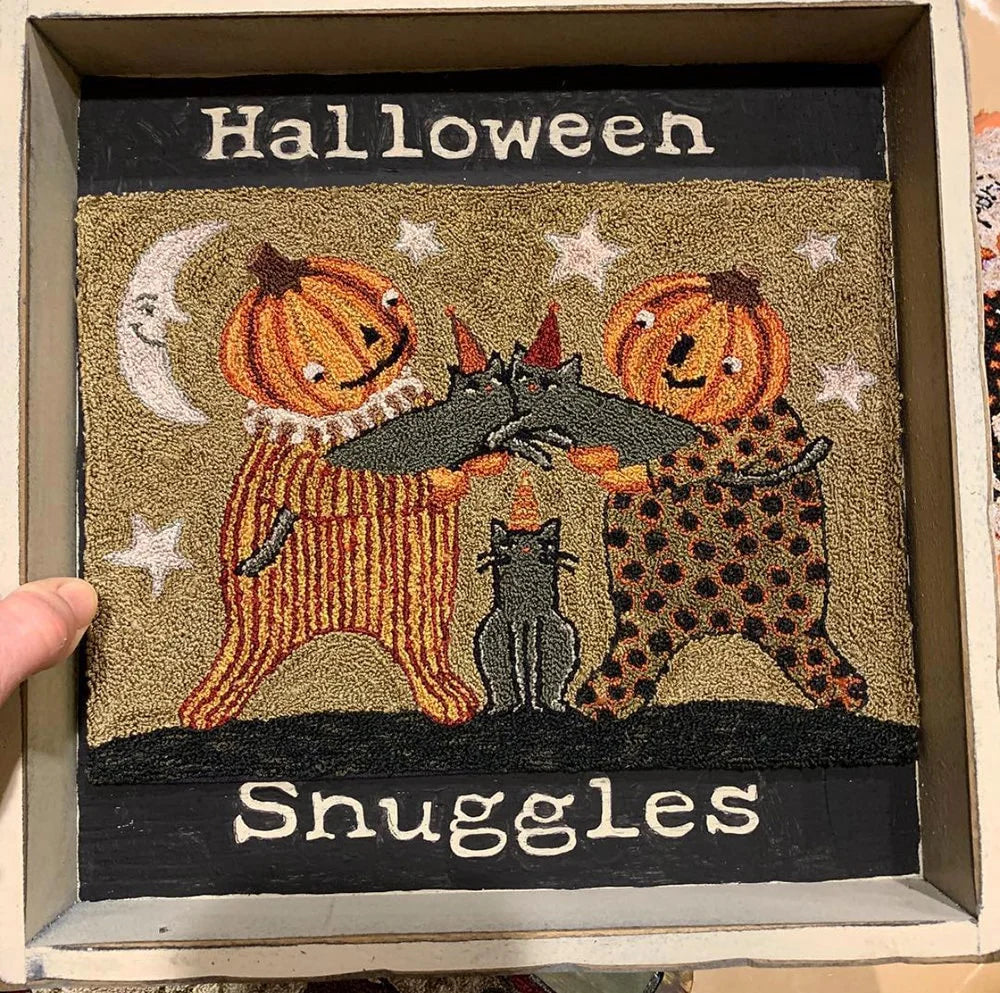 Halloween-themed wall decor featuring two pumpkin characters, two black cats, and cozy wording.