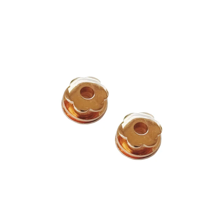 Gold flower-shaped earrings made of metal, perfect for adding a touch of elegance to any outfit.