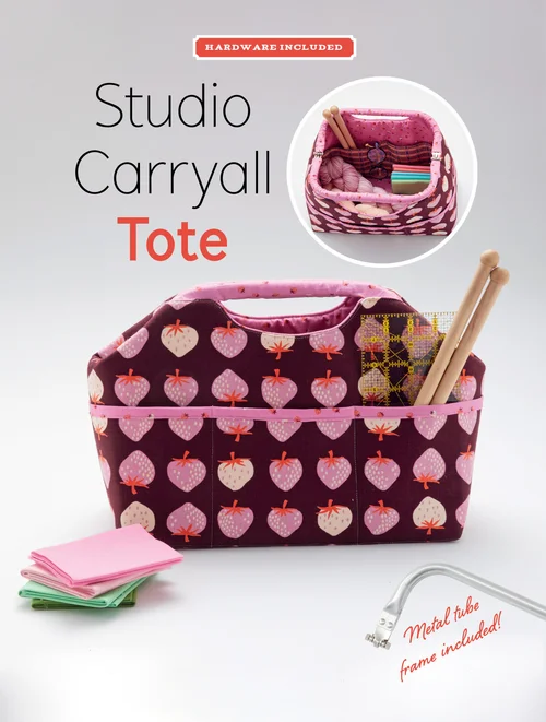 Studio Carryall Tote in berry pattern, features durable material and included metal tube frame for stability.
