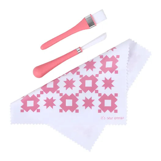 Pink silicone tools and patterned cloth for crafting, ideal for baking and decorating projects.