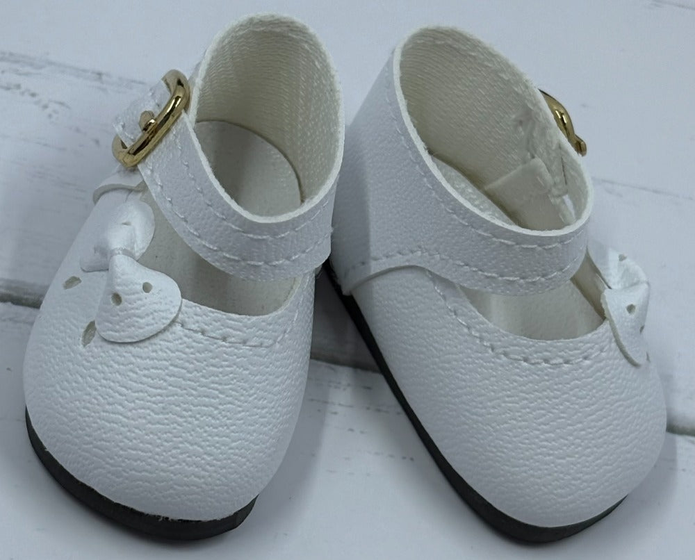 White girls' Mary Jane shoes made of faux leather with a cute bow and adjustable strap.