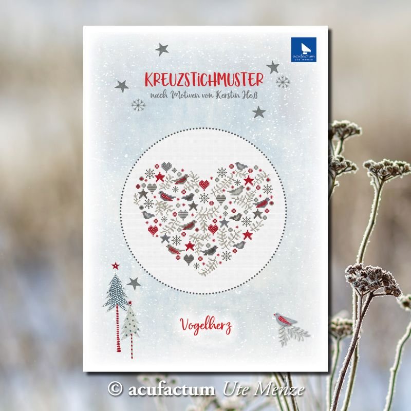 Cross-stitch pattern featuring a heart design with red, gray, and white motifs, perfect for festive crafting.