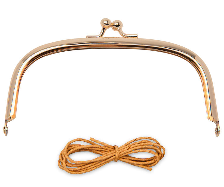 Gold metal purse frame with clasp and brown cord for DIY bags or clutches, stylish accessory for crafting.